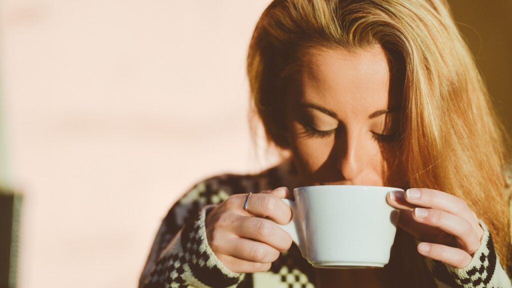 woman drinking fire cider